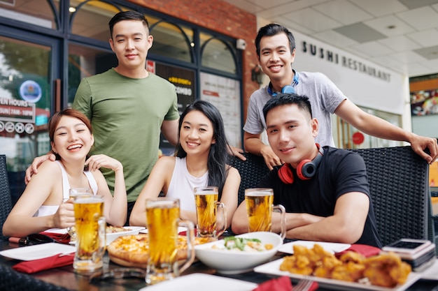 Asian friends sitting at the restaurant