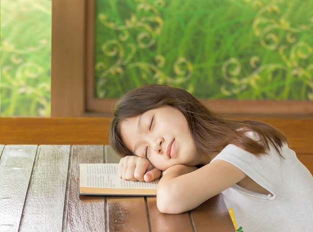 Asian gir sleeping while learning