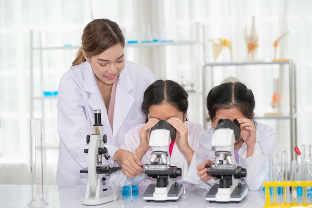 Asian girl are student in science with teacher