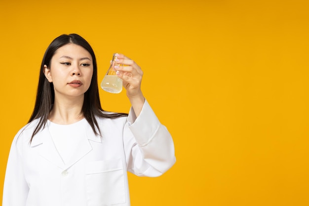 Asian girl doctor in a white coat