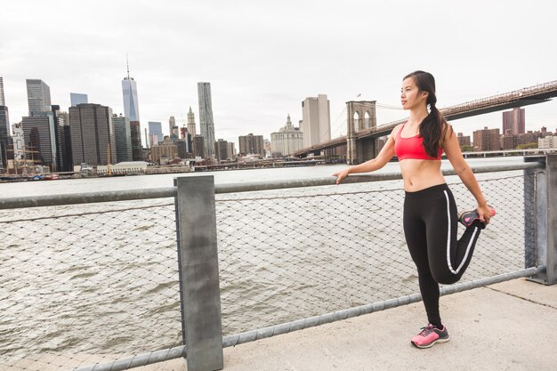 Asian Girl Doing Stretching Exercises in New York