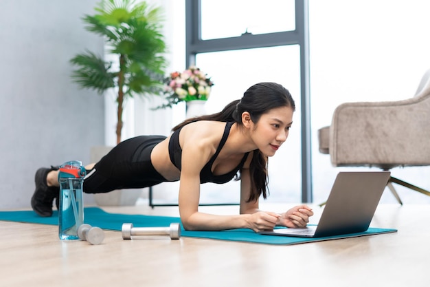 Asian girl exercising at home