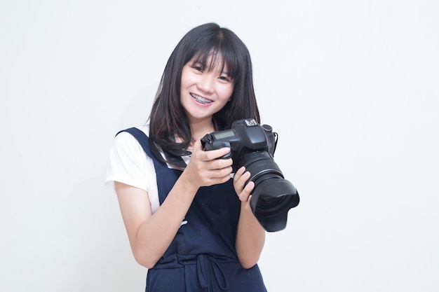 Asian girl holding a camera