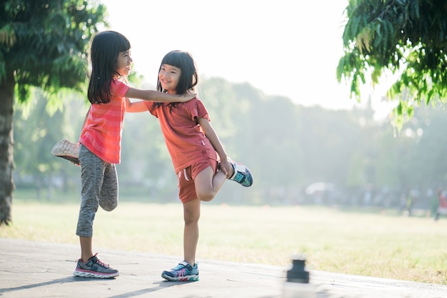 Asian girl is jogging in the park in the morning