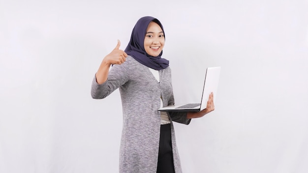 Asian girl opening laptop gesture ok isolated on white background