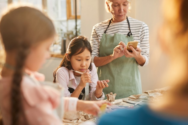 Asian Girl in Pottery Studio