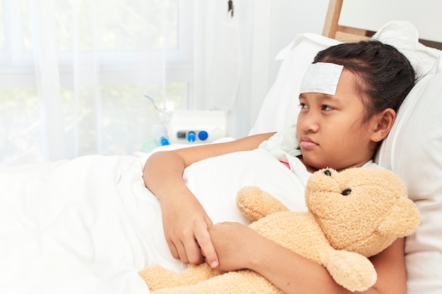 Asian girl sleeping in hospital