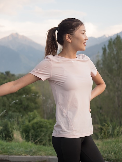 Asian girl in sportswear in the park.