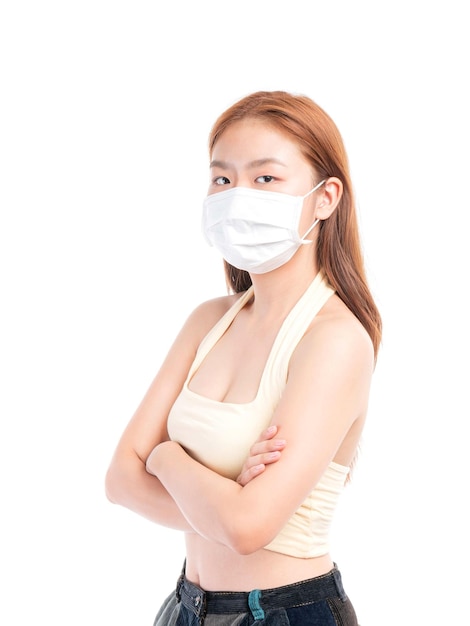 Asian girl standing arms crossed wearing protective face mask for protection during the quarantine Coronavirus covid19 outbreak on white background protect spread Covid19