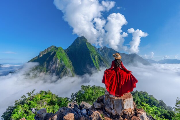 Asian girl on top of viewpoint of nong khiaw - a secret village in laos