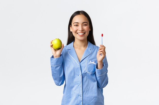 Asian girl wearing blue pajamas posing