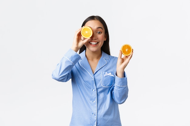 Photo asian girl wearing blue pajamas posing