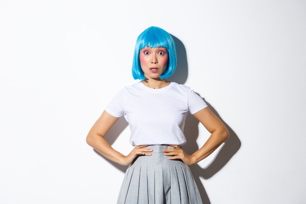 Asian girl wearing a blue short wig