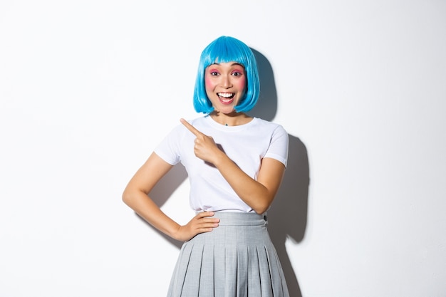 Asian girl wearing a blue short wig