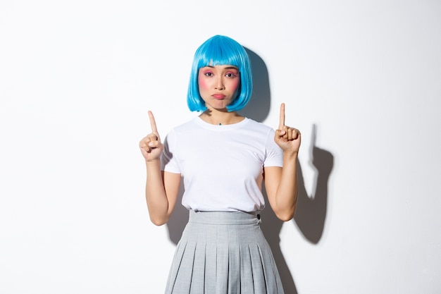 Asian girl wearing a blue short wig