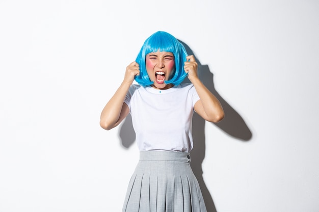 Asian girl wearing a blue short wig