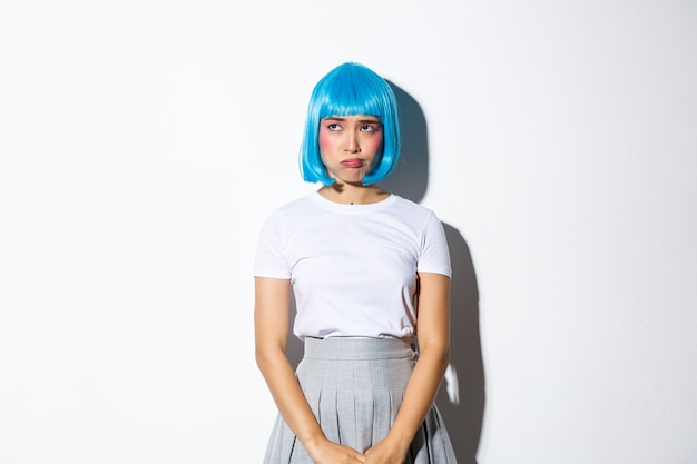 Asian girl wearing a blue short wig