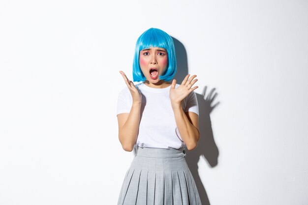 Asian girl wearing a blue short wig