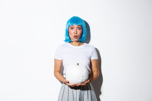 Asian girl wearing a blue wig posing