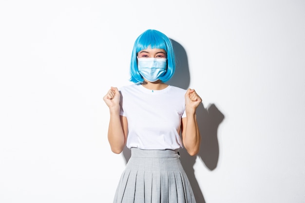 Asian girl wearing a blue wig posing