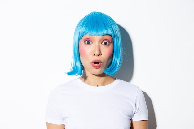 Asian girl wearing a blue wig posing