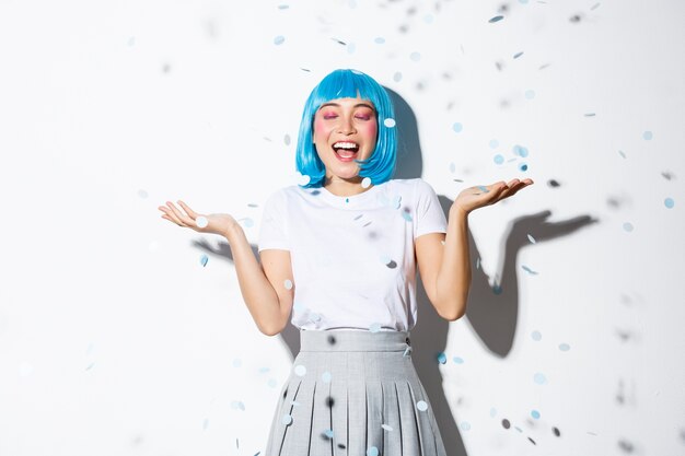 Asian girl wearing a blue wig posing