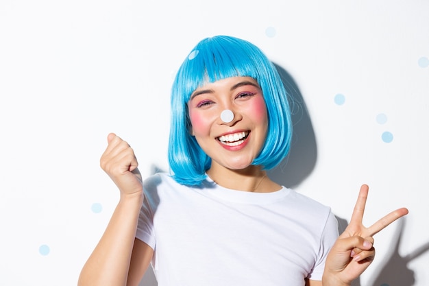 Asian girl wearing a blue wig posing