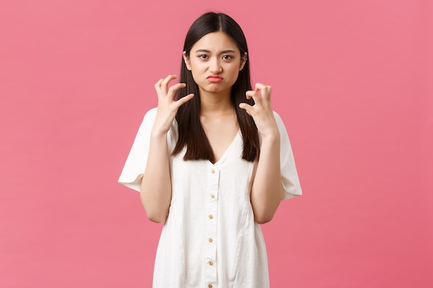 Asian girl in a white dress posing