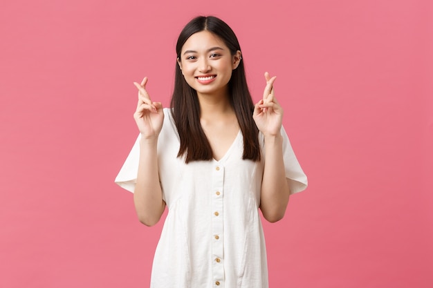 Asian girl in a white dress posing