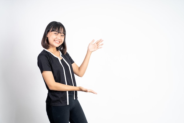 Asian girl with hand gesture presenting something on isolated