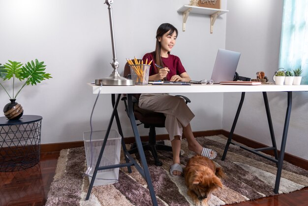 Asian girl working remotely from home