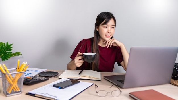 Asian girl working remotely from home