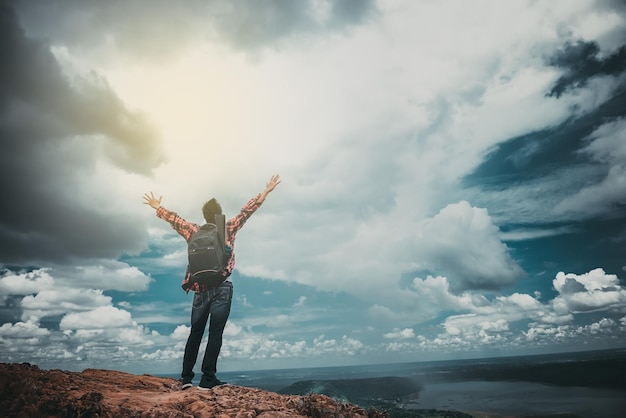 Asian handsome man on the top of mountain