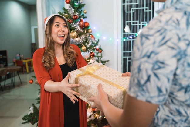 Asian happy family celebrating Christmas together at home