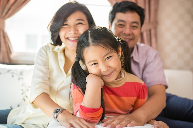 Photo asian happy family smile at home.