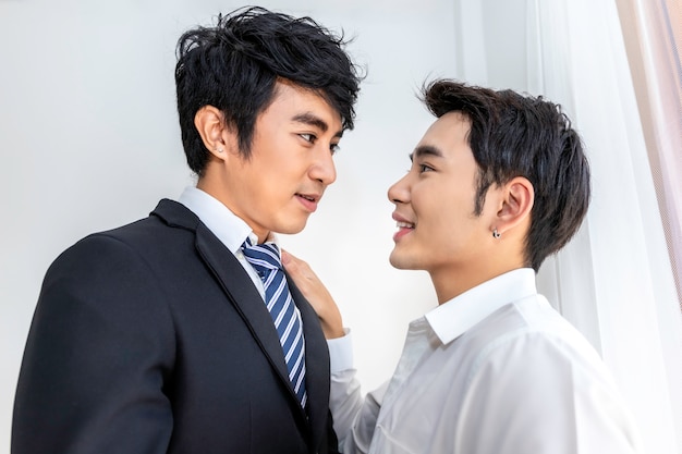 Asian homosexual couple in love looking into each others eyes