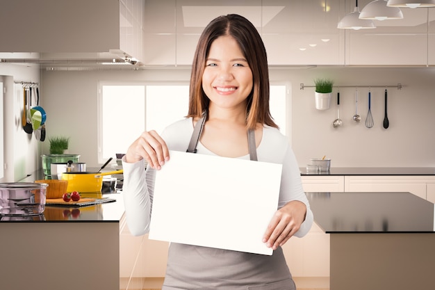 Asian housekeeper with kitchen background