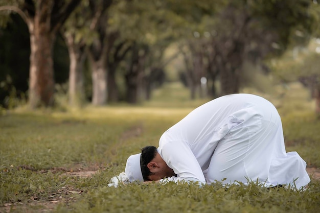 Asian islam man prayerYoung Muslim prayingRamadan festival concept