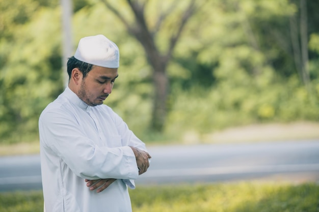 Asian islam man prayerYoung Muslim prayingRamadan festival concept