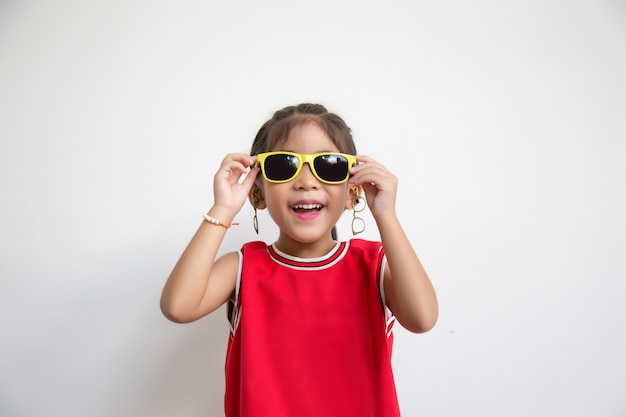 Asian kid with sport shirt and sun glasses fashion