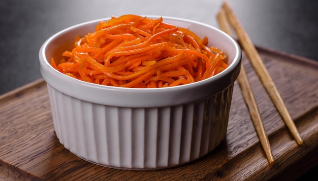 Asian, korean carrot salad with spices, olive oil and garlic