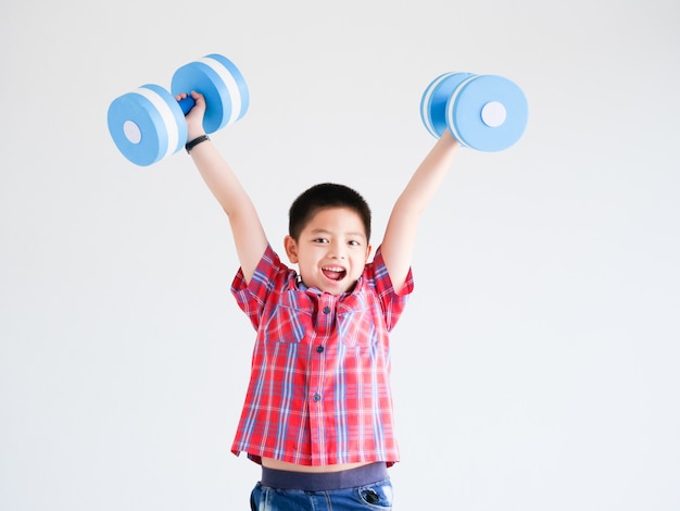 Asian little boy with blue color dumbbell 