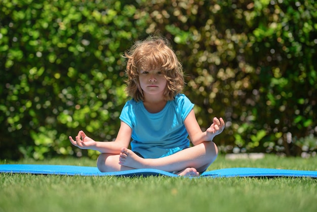 Asian little cute girl do a yoga at home with space for add text