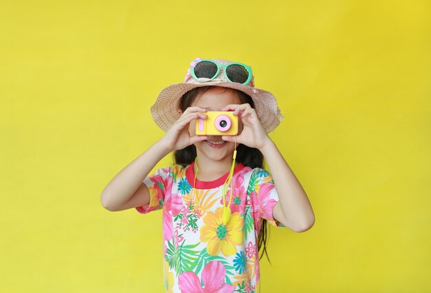 Asian little girl taking photos