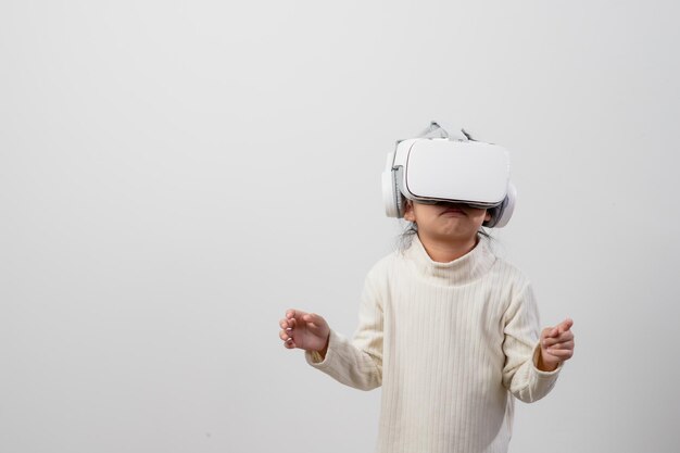 Asian little girl with virtual reality headset Innovation technology and education concept