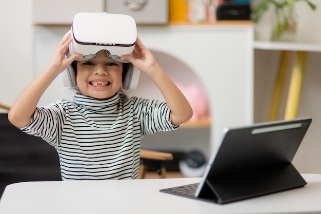 Photo asian little girl with virtual reality headset innovation technology and education concept