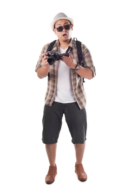 Asian male backpacker photographer tourist Taking Pictures with his mirrorrless