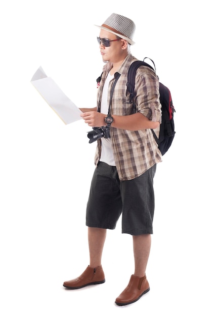 Asian male backpacker tourist wearing hat sunglasses camera and backpack Looking at map