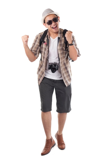 Photo asian male backpacker tourist wearing hat sunglasses camera kshowing surprised happy winning gesture