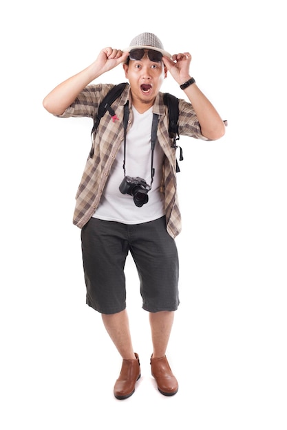 Asian male backpacker tourist wearing hat sunglasses camera showing surprised happy winning gesture